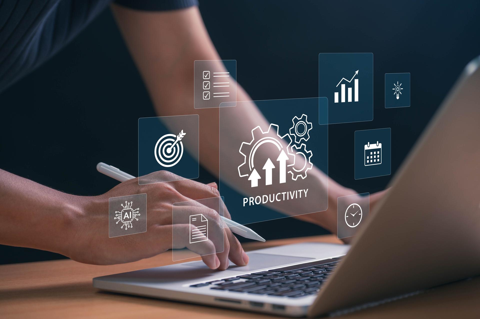 Boosting Productivity with AI and Automation Tools. hands using laptop with tech icons showing goals, schedules, and innovation, symbolizing data driven success and efficient workflow strategies